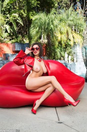 Darcie Dolce Poses Outside In Heart Sunglasses And Heels 03